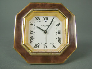 Appraisal: A gilt brass framed hexagonal strut bedside alarm clock with