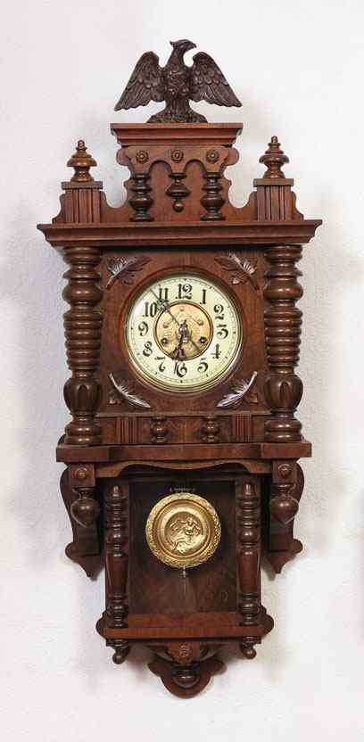 Appraisal: GERMAN CARVED WALL CLOCK Carved wood eagle finial walnut case