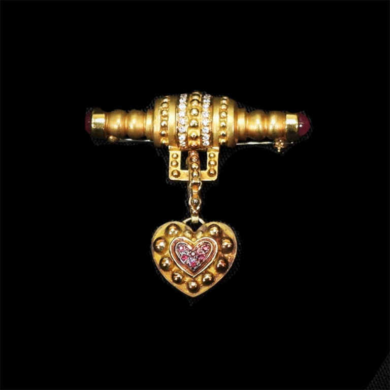 Appraisal: K GOLD DIAMOND RUBY HEART BROOCH K yellow gold bar