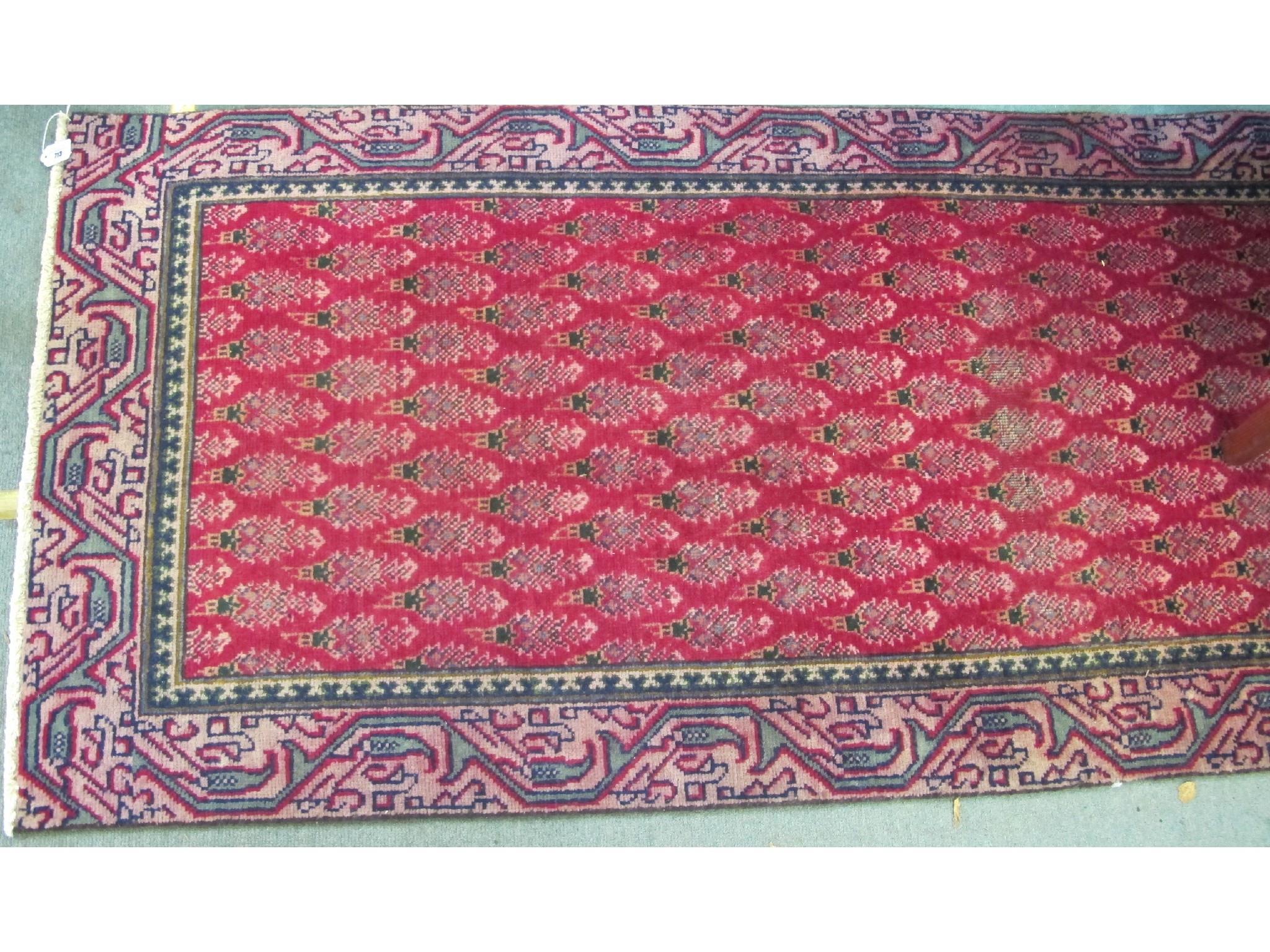 Appraisal: A Tabriz runner on a red and green ground x