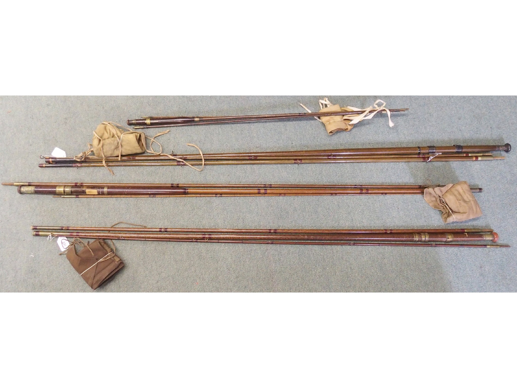 Appraisal: Four wood fishing rods