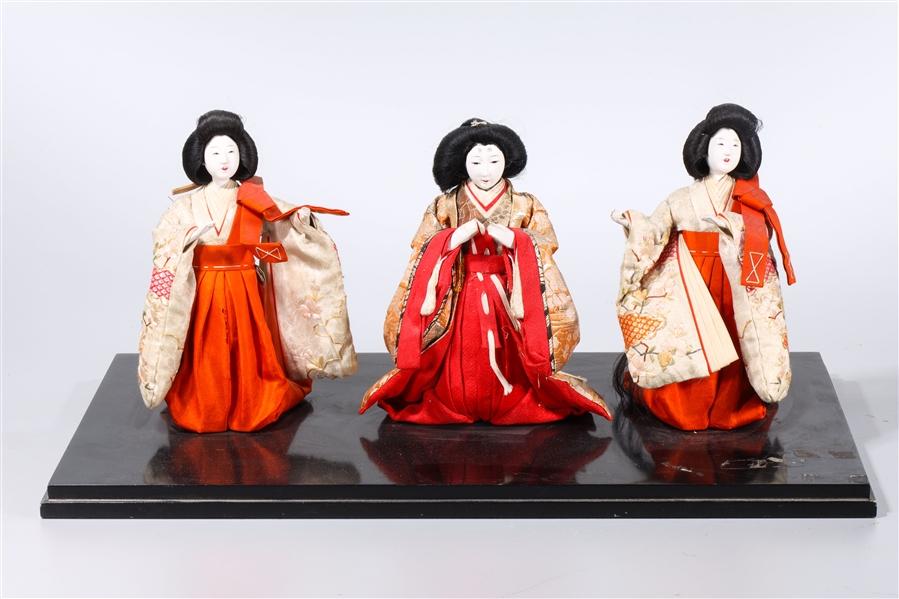 Appraisal: Group of three Japanese geisha dolls with stand x x