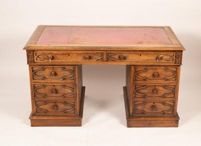 Appraisal: A Gothic Revival pedestal desk fitted eight drawers around a