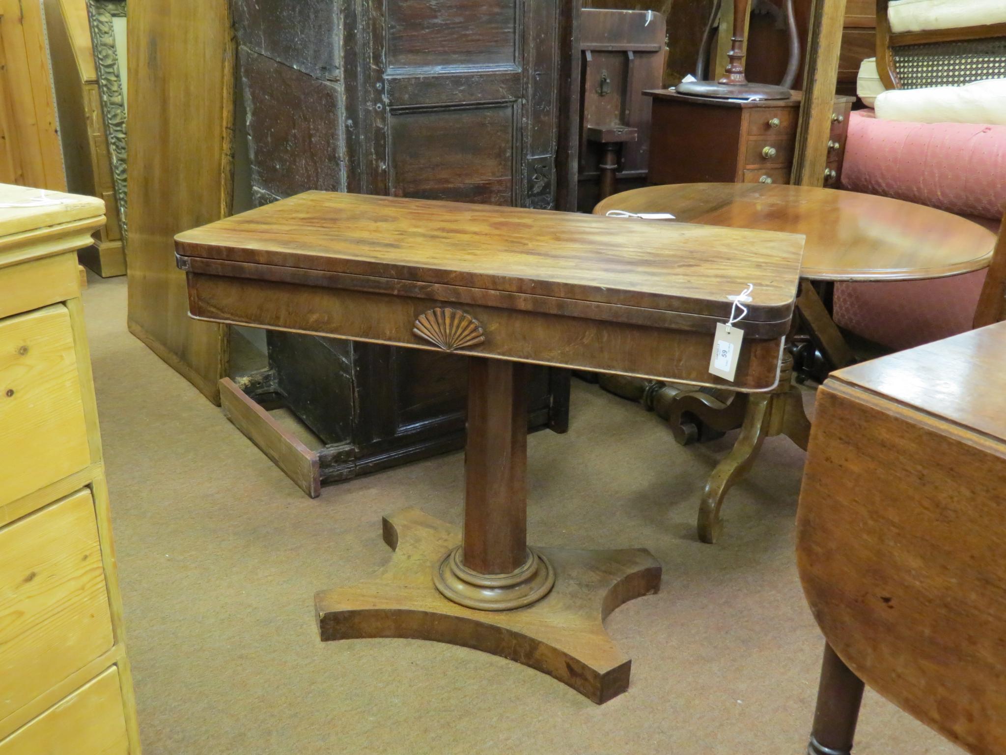 Appraisal: A George IV mahogany card table D-shape top revolving on