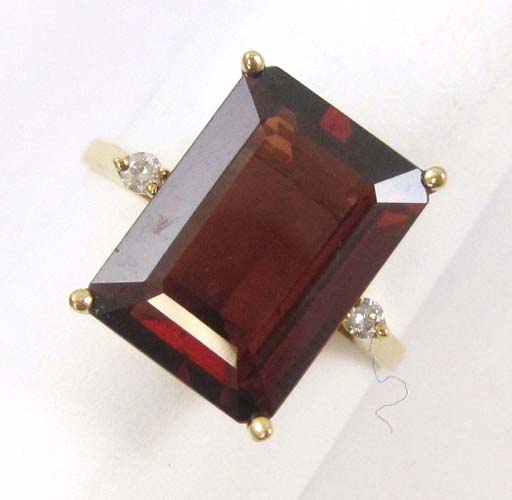 Appraisal: GARNET DIAMOND AND FOURTEEN KARAT GOLD RING set with a