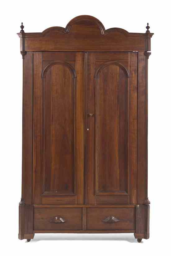 Appraisal: An American Cherry Knock Down Armoire having an arched and