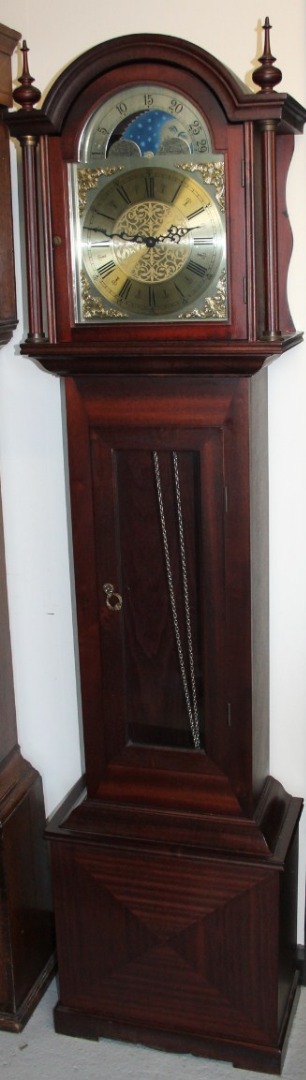 Appraisal: A modern mahogany finished long case clock the arched cm