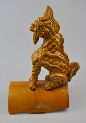 Appraisal: A Chinese stoneware roof finial in the form of a