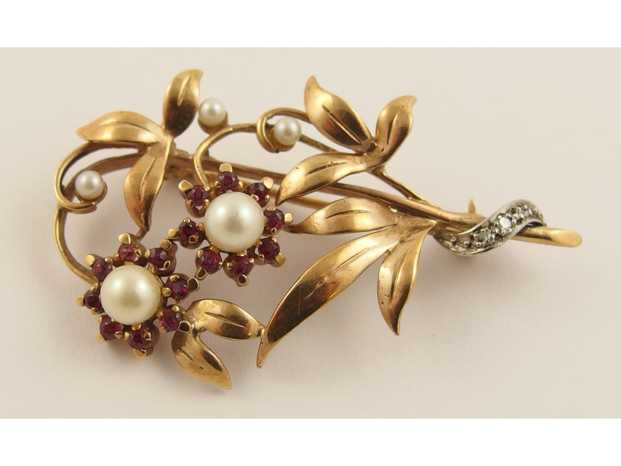 Appraisal: A ct floral brooch set with pearls rubies and diamonds