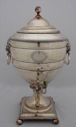 Appraisal: ENGLISH SILVER-PLATED HOT WATER URN The ovoid bowl with wreath-enclosed