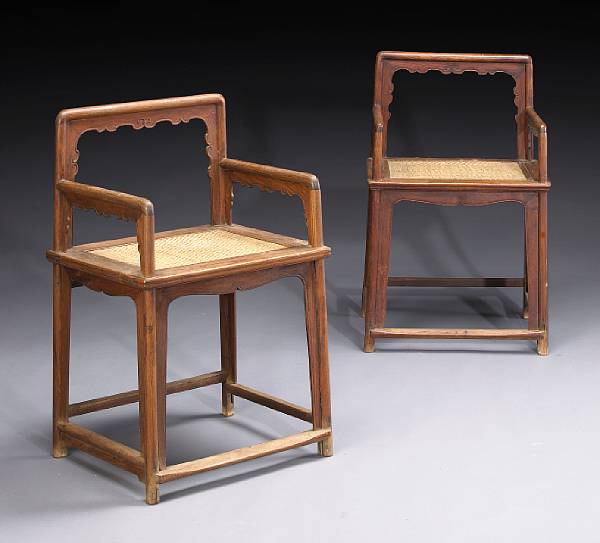 Appraisal: A pair of huanghuali low back armchairs meiguiyi wenyi th