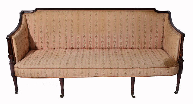 Appraisal: A GEORGE III MAHOGANY SETTEE with fluted baluster column supports