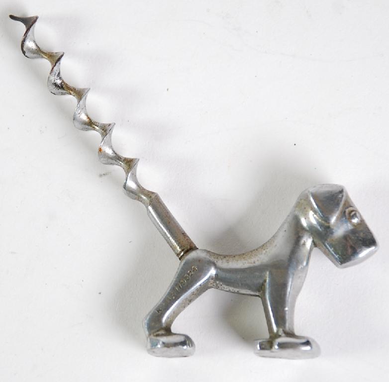 Appraisal: METAL COMIC DOG PATTERN CORKSCREW AND AN ORIENTAL LACQUERED HOLLOW