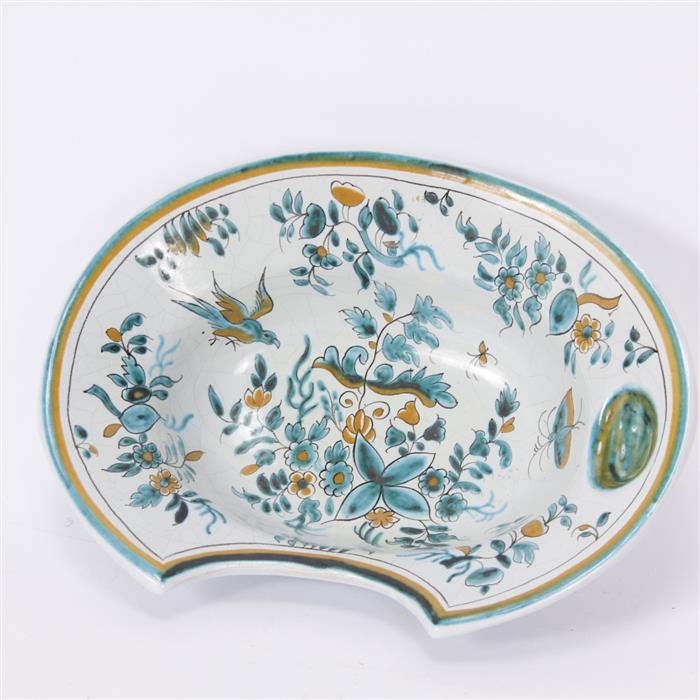 Appraisal: French faience polychrome shaving bowl with bird and foliate decoration