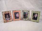 Appraisal: Four small photo frames with floral borders each x cm