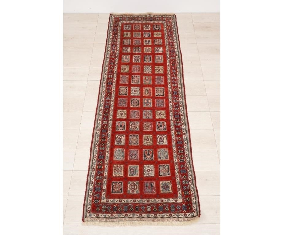 Appraisal: Persian hall runner with red field and colorful geometric squares