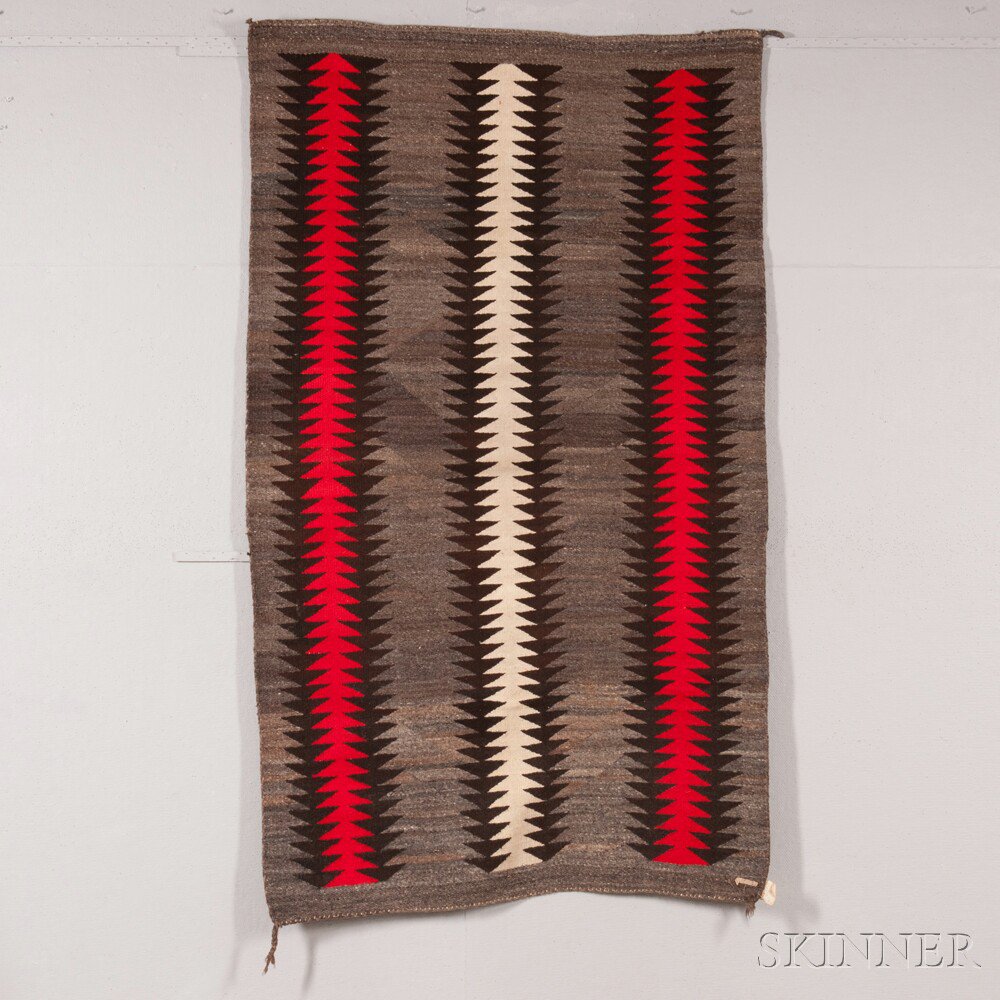 Appraisal: Navajo Rug with three sawtooth columns on a variegated gray