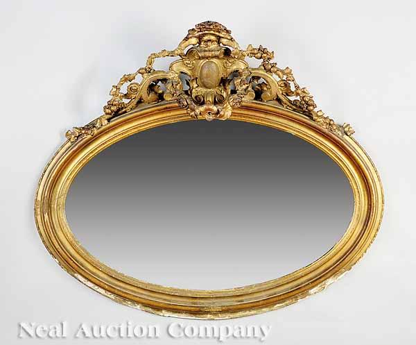 Appraisal: An American Rococo Carved Giltwood Overmantel Mirror mid- th c