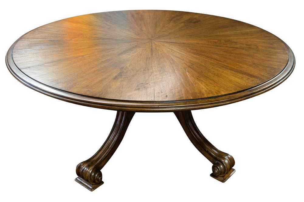 Appraisal: THERIEN MAHOGANY ROUND DINING TABLEwith five curved extensions attaching to