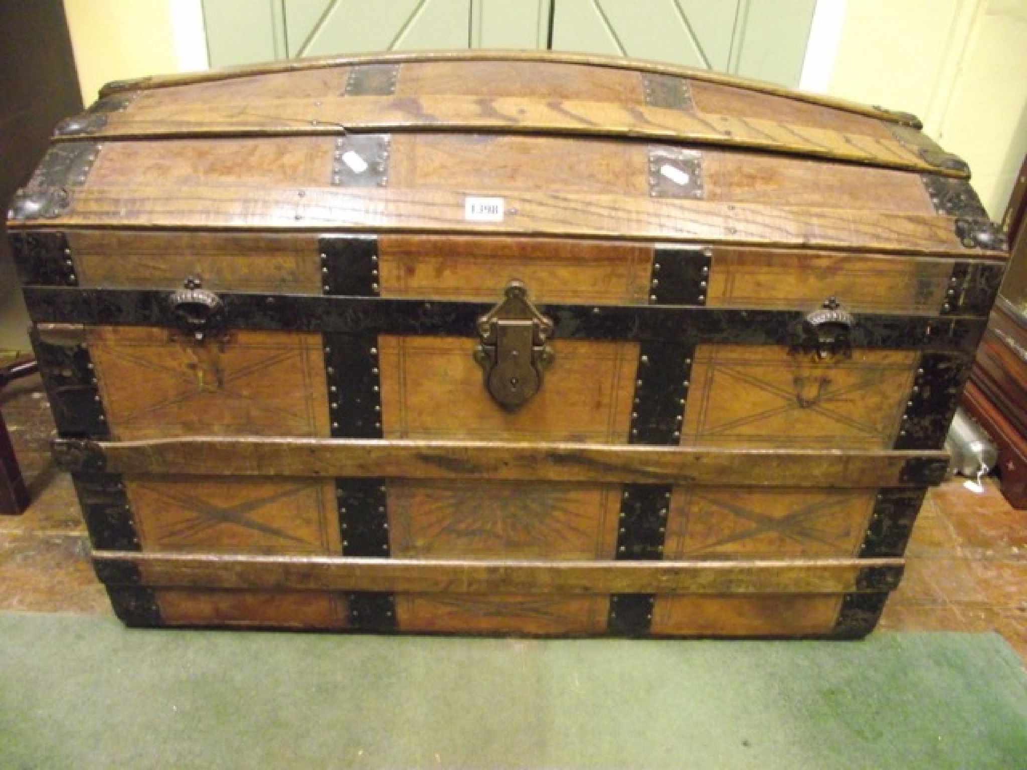 Appraisal: A late th century travel trunk with suede leather panels