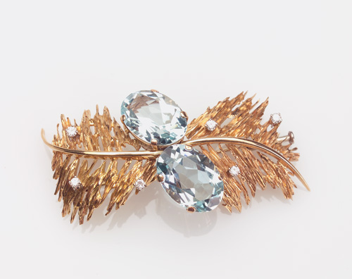 Appraisal: MODERN Aquamarine and diamond bypass brooch in k yellow gold