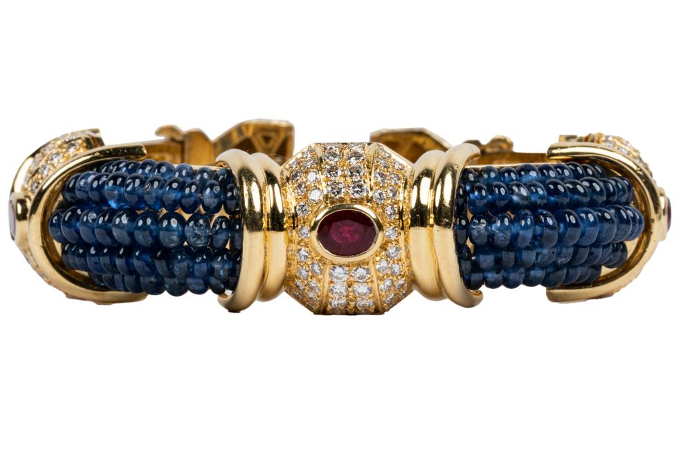 Appraisal: KARAT YELLOW GOLD SAPPHIRE RUBY DIAMOND BRACELETcontaining round brilliant cut