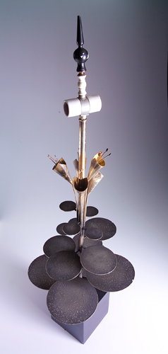 Appraisal: MODERN Table lamp with circular patinated metal disks calla lily