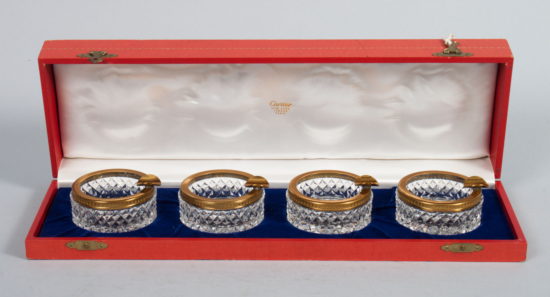 Appraisal: Four Cartier cut crystal ash trays four gilt-metal-mounted cut crystal