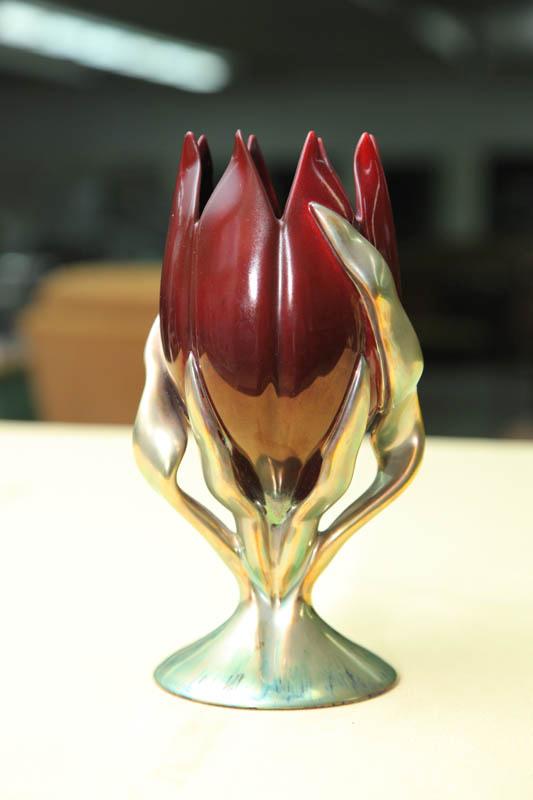 Appraisal: ZSOLNAY GOBLET Sawtooth rimmed tulip with foliage on a round