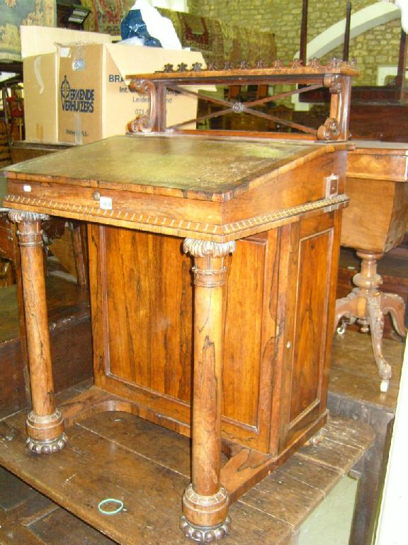 Appraisal: A Regency rosewood Davenport with raised upper section with decorative