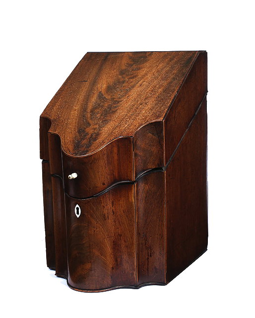 Appraisal: A GEORGE III MAHOGANY KNIFE BOX with a sloping top