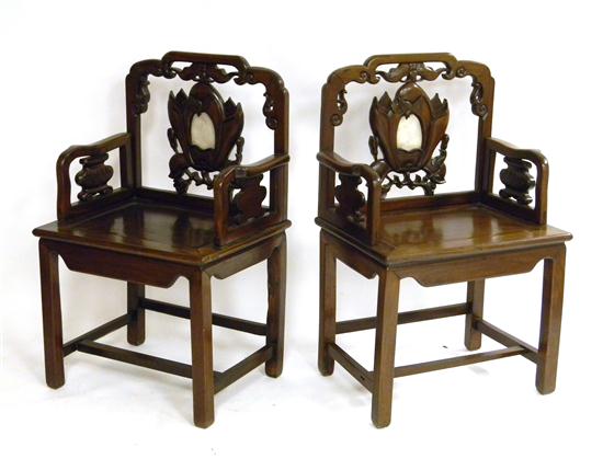 Appraisal: Pair of elaborately carved blackwood armchairs alabaster inset and pierced