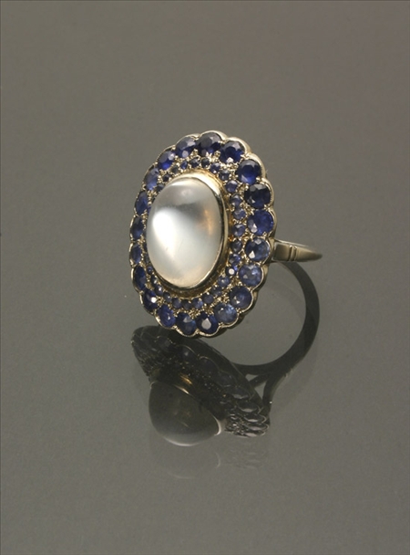 Appraisal: -Karat White-Gold Moonstone and Blue Sapphire Dinner Ring The bezel