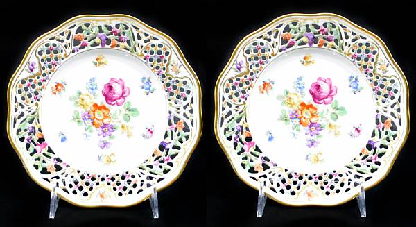 Appraisal: A group of four German porcelain side plates with reticulated