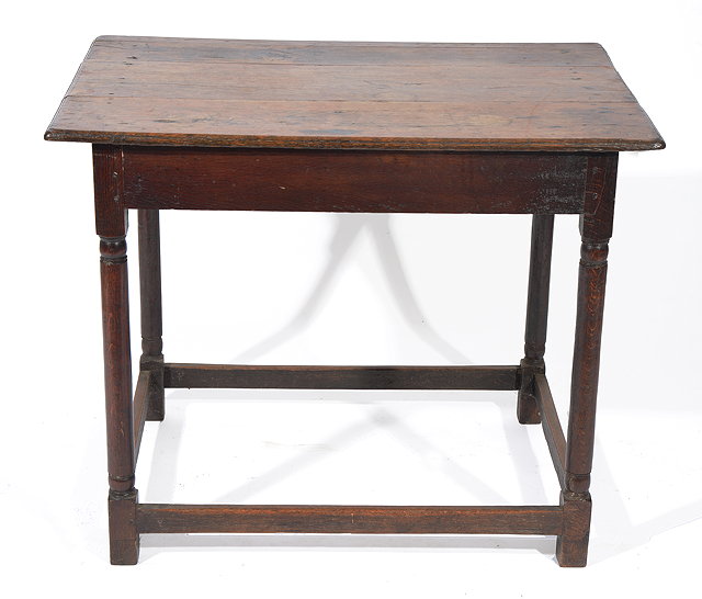 Appraisal: AN ANTIQUE OAK RECTANGULAR TOPPED CENTRE TABLE standing on turned