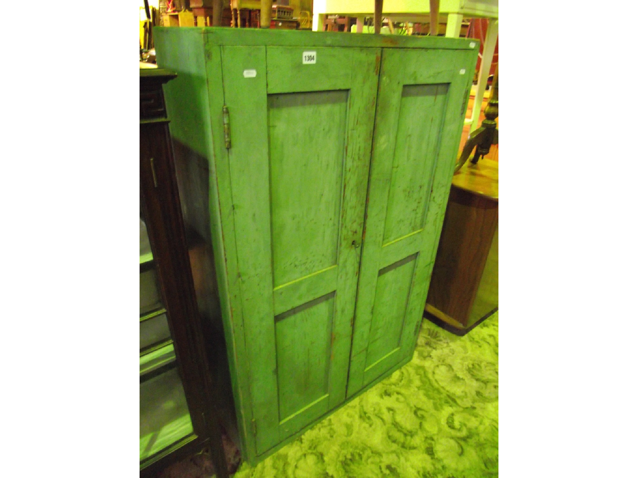 Appraisal: A vintage freestanding pained pine side cupboard enclosed by a