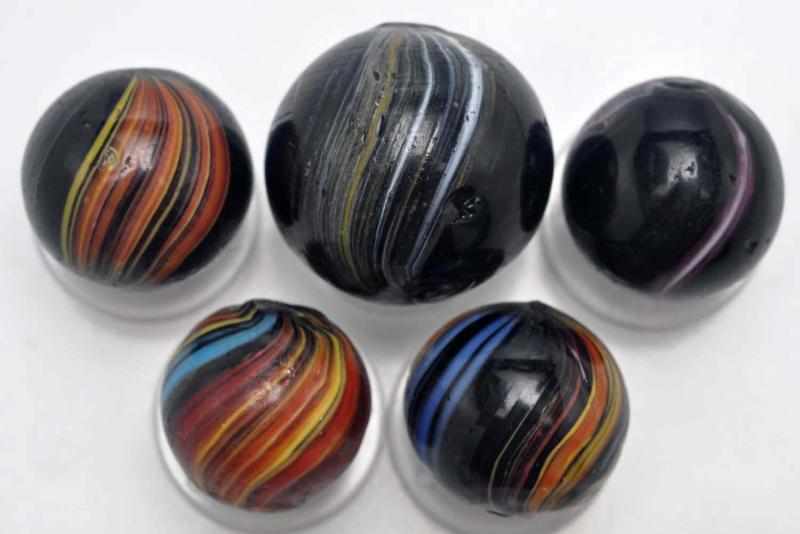 Appraisal: Lot of Indian Swirl Marbles Description Includes five multicolored Indians