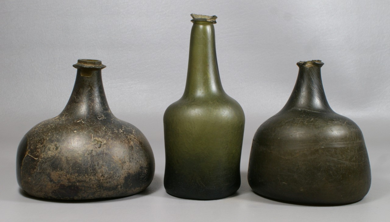 Appraisal: th c olive hand blown bottles with rim chips tallest