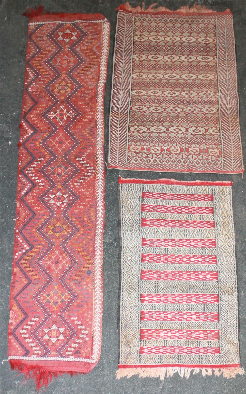 Appraisal: THREE ASSORTED FLAT WEAVE TRIBAL RUGS INCLUDING A RUNNER largest