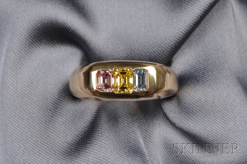 Appraisal: Fancy Colored Diamond and Diamond Three-stone Ring set with fancy