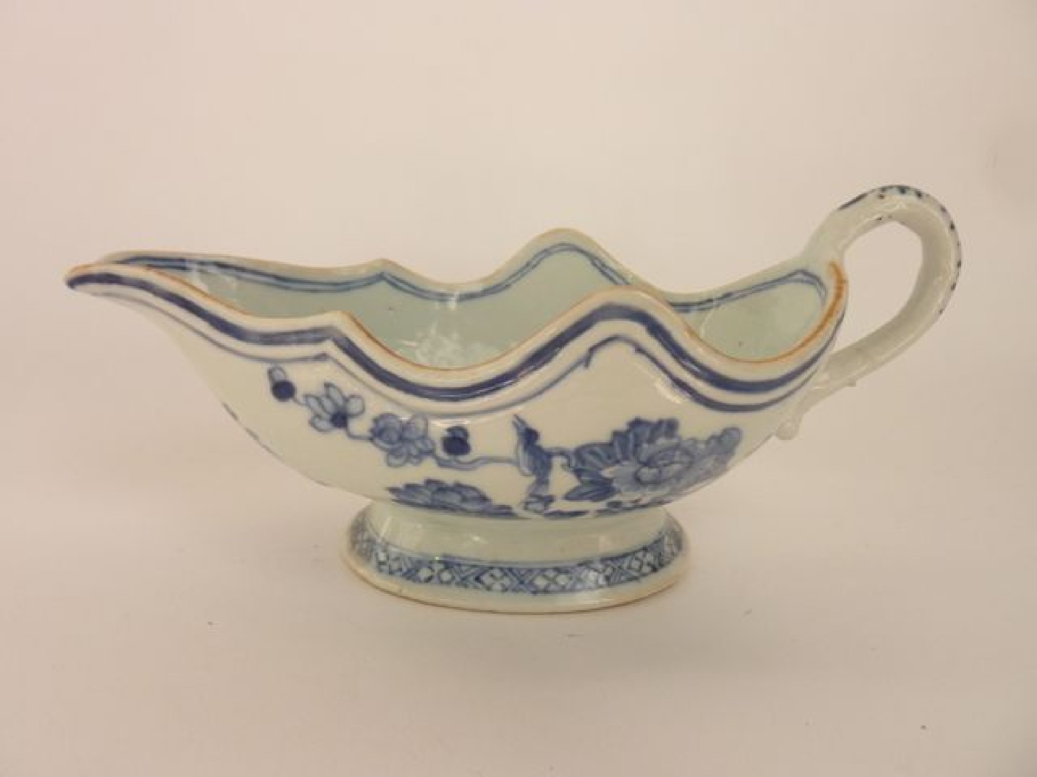 Appraisal: An early th century oriental blue and white sauce boat