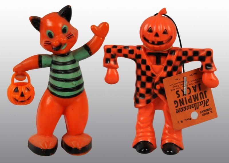 Appraisal: Lot of Plastic Halloween Toys Description Cat holds small pumpkin