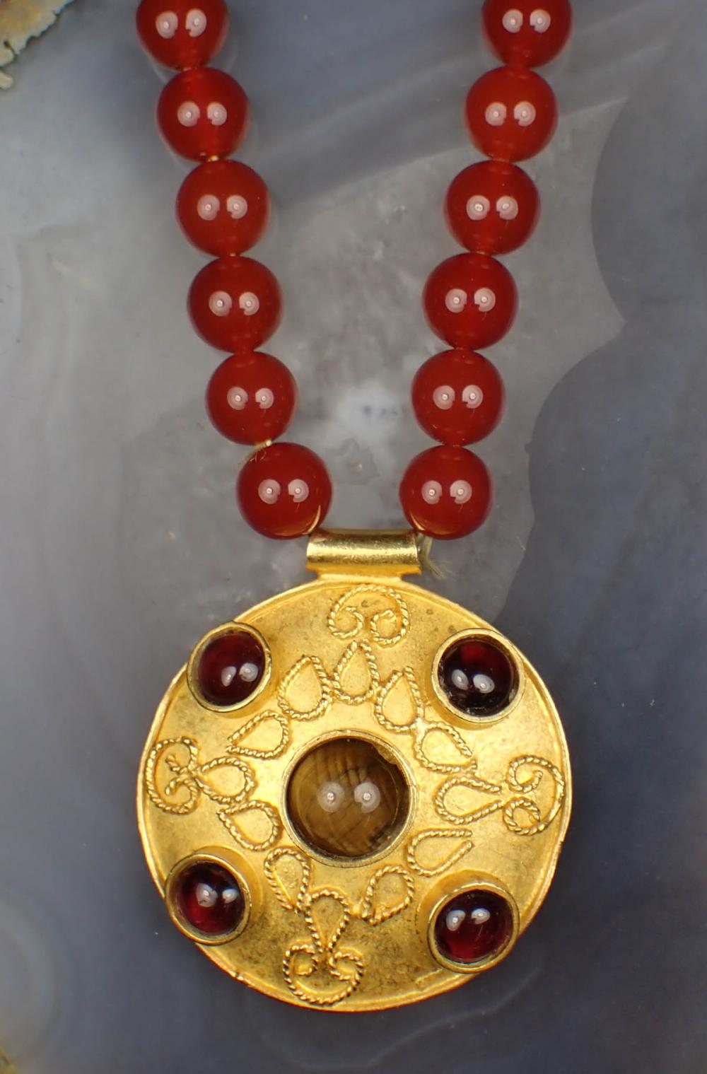 Appraisal: CARNELIAN AND EIGHTEEN KARAT GOLD NECKLACE The necklace strung with