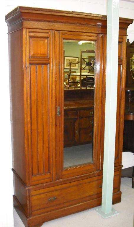 Appraisal: Edwardian walnut wardrobe with single mirrored door over a long