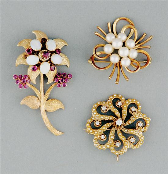 Appraisal: Gold brooches flower form set with five oval cabochon-cut opals