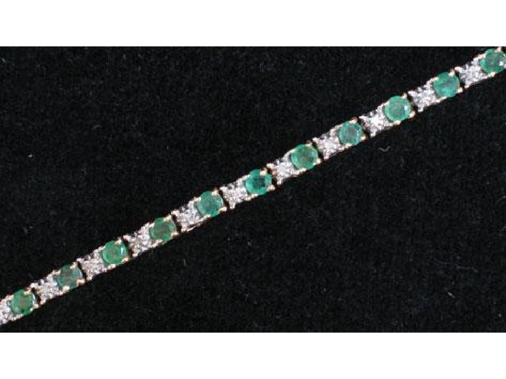 Appraisal: A MODERN EMERALD AND DIAMOND BRACELET each link claw-set with