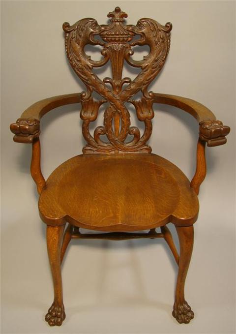 Appraisal: ELABORATELY CARVED ENGLISH OAK HALL CHAIR the narrow back carved