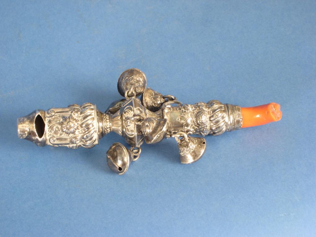 Appraisal: An early th Rattle with floral and scroll embossing fitted