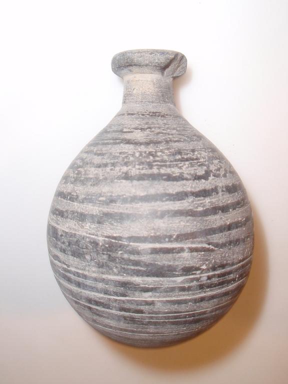 Appraisal: An ancient hard grey pottery bottle with a bulbous mouth