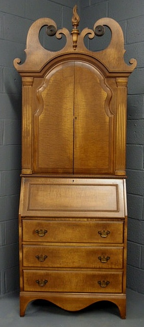 Appraisal: Chippendale style fruitwood secretary desk with a broken arch flame